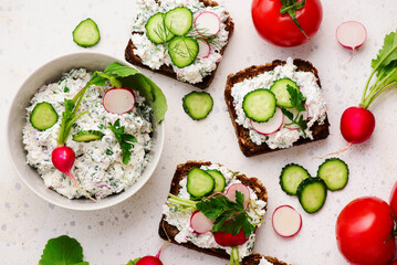 Canapes with cottage cheese with herbs and radishes.selective focus