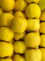 Yellow apples displayed at a market