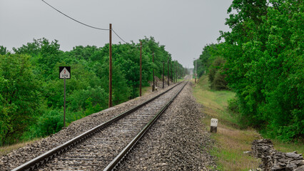 Empty stretch of straight railway track leading towards pula, croatia close to station of Vodnjan....