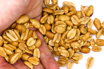 roasted salted peanuts photographed close-up on a white background