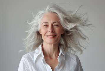 Portrait of beautiful natural mature woman with grey hair
