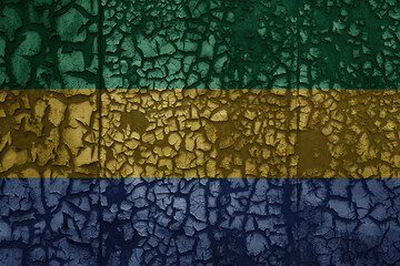 flag of gabon on a old grunge metal rusty cracked wall background
