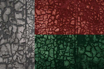 flag of madagascar on a old grunge metal rusty cracked wall background