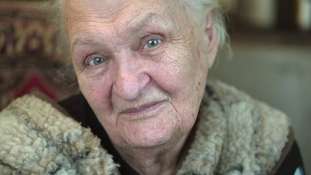 Portrait of a gray-haired elderly woman.
