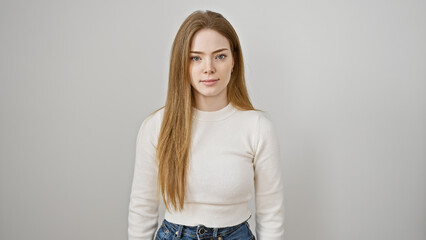 Portrait of a serene young woman with blonde hair against a white background, embodying simplicity and elegance.