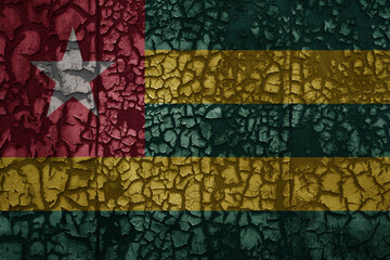 flag of togo on a old grunge metal rusty cracked wall background