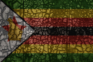 flag of zimbabwe on a old grunge metal rusty cracked wall background