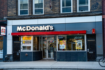 Obraz premium McDonald's in downtown Toronto. McDonald's Corporation is an American multinational fast food chain. Toronto, Canada - April 30, 2024.
