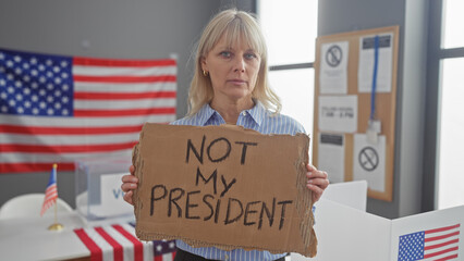 Caucasian woman protesting with sign in american election center,