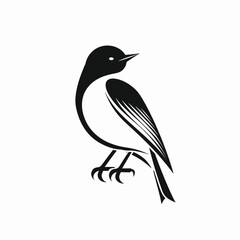 Obraz premium Black and white silhouette of a bird perched on a branch.