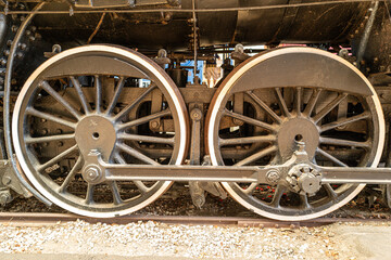Steam train wheels on railroad track