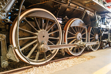 Steam train wheels on railroad track