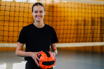Portrait of a smiling female professional volleyball player