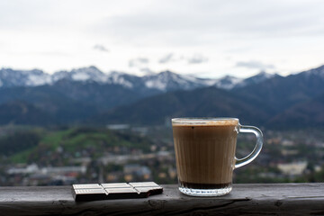 Morning coffee with a chocolate bar overlooking the mountains 