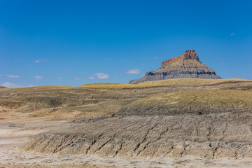Beautiful desert landscape with Factory Butte in background.