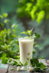 Refreshing White Mojito on a Green Background