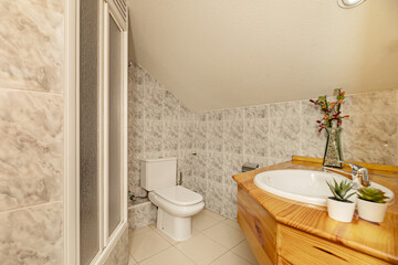 Bathroom of a house with pine wood sink cabinet