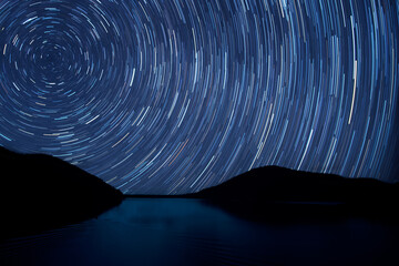 Beautiful star trail image during the night of the Geminids meteor shower in the Winter.