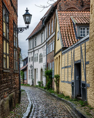 Obraz premium Narrow street in old town of Lüneburg, Lower Saxony, Germany