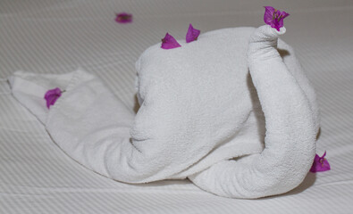 Creative cleaning of rooms in hotels in Egypt. The bed is decorated with objects made of towels.