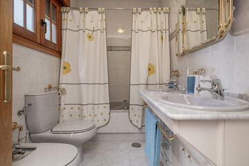 An old-fashioned bathroom with curtains covering the bathtub