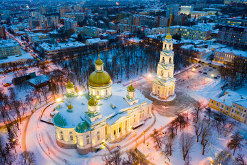 Aerial view of lighted five domed church and bell tower of Spassky Cathedral in Penza in winter...