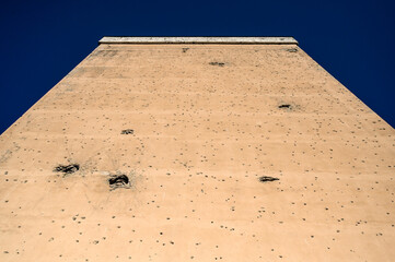 Holes of bullets and shells on the wall of resident building. Remnants of the war in Sarajevo, Bosnia and Herzegovina. A holes in the wall from shelling.