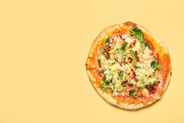 Delicious vegetarian pizza on yellow table, top view. Space for text