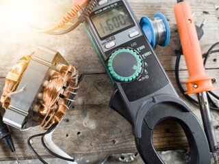 Fan motor winding repair process, concept of checking and repairing motor windings using a tester.