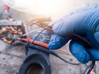 Fan motor winding repair process, concept of checking and repairing motor windings using a tester.