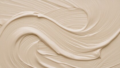 Obraz premium A swirl of a creamy beige substance spread in waves to create a background texture of quiet luxury concept.
