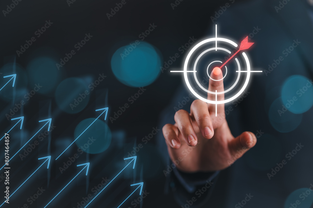 Poster businessman touching virtual dartboard with arrow ,business achievement objective target concept.