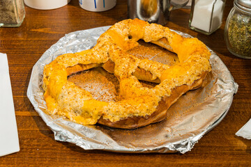 Soft pretzel with crab dip and cheese