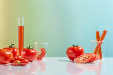 Plenty natural tomatoes featured on white table with laboratory glassware consist of measuring cylinder, test tube, petri dish and beaker. Blank space for advertising, front view
