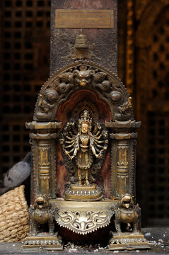 Lalitpur (Patan), Nepal - April 26, 2023: Mayajala Lokeshwor Gilt Copper Statue in Golden Temple (Hiranya Varna Mahavihar or Kwa Bahal)
