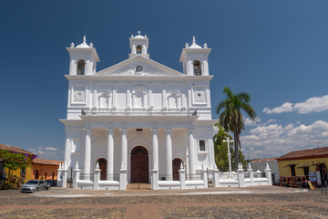 Santa Lucia cathedral - main church painted in bright white  color in a small tourist town of Suchitoto, El Salvador.