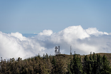 Wireless telecommunications site on mountaintop as viewed from top of Haleakalā National Park, Maui, Hawaii
