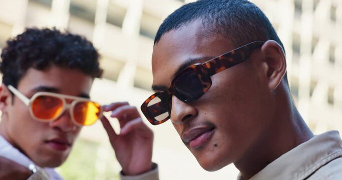 Outdoor, men and fashion in portrait with confidence for campaign, style and streetwear in Spain. Friends, stylist and gen z with sunglasses for eyewear with trendy clothes, attitude and cool