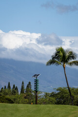 Solar powered tsunami sirens on a tropical golf course, pacific ocean tidal wave warning system on...