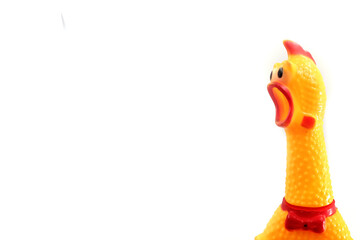 cute rubber chicken toy on white background