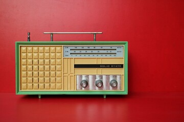 vintage yellow transistor radio red wallpaper background