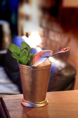 Mint Julep, drink with mint leaves, bourbon whiskey, sugar syrup, angostura and ice