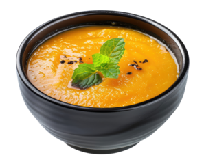Black bowl with pumpkin cream soup isolated on transparent background