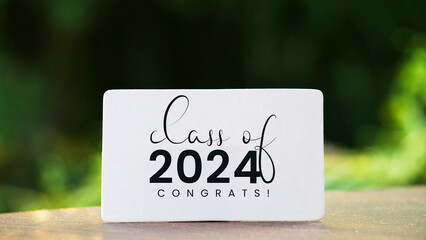 Class of 2024 card with bokeh background. Senior 2024. congratulations graduates. 