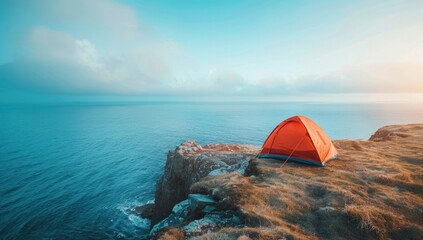 A tent pitched on the edge of a cliff, the vast expanse of the ocean stretching out below.