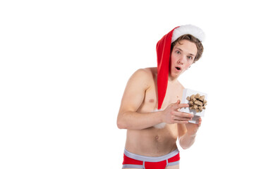 Christmas and New Year. Handsome young man in Santa Claus costume posing on white background.