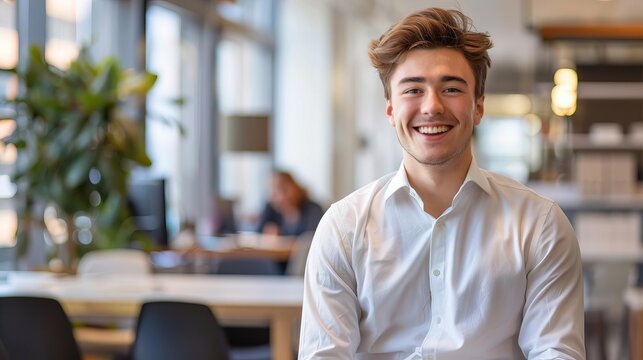Young professional smiling confidently in an office environment
