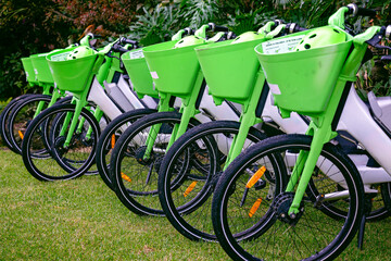 Fototapeta premium bikes bicycles city community communal transportation, green public transport, exercise healthy lifestyle, electric sustainable congestion solution, urban town planning design