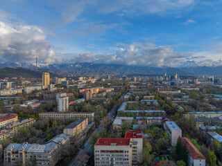 Naklejka premium View from a quadcopter of the central part of the Kazakh city of Almaty on a spring evening