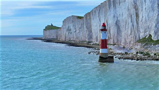 Lighthouse in the Sea with a Large Chalk Cliff
